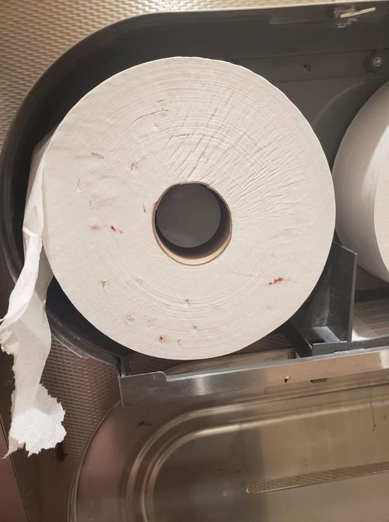 In the video, Devan showed a photo of a toilet roll with open red holes, which appeared to be blood-like stains.